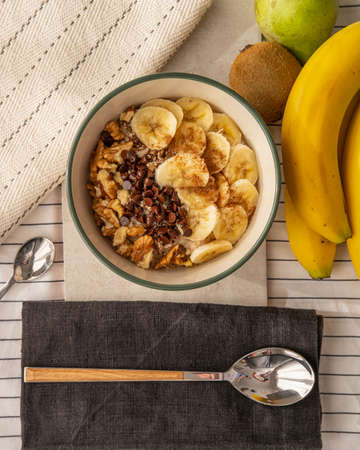 A porridge with banana walnuts and chocolate chips.の写真素材