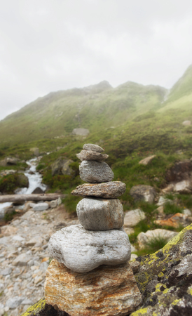 Pile of stones, mountains in the background.の写真素材