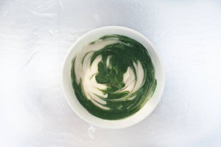 Spirulina yogurt on metallic backgroundの写真素材