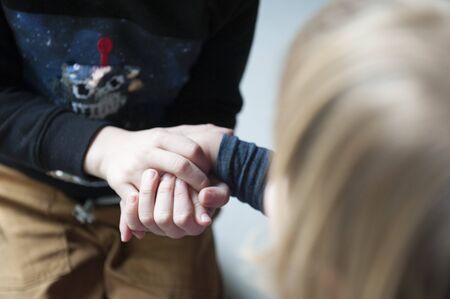 Children helping each other at schoolの写真素材