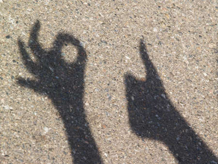 Play of light and shadows on the street pavementの写真素材