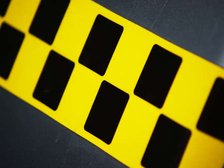 Line with black and yellow taxi sign on the carの写真素材