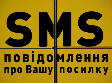 Black message sign on the yellow backgroundの写真素材