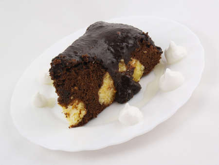 Chocolate cake on the white plate on the white backgroundの写真素材