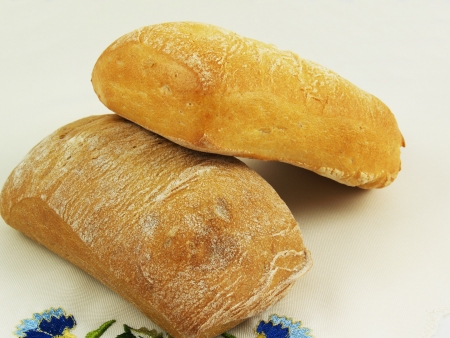 Delicious fresh home-made whole wheat bread on the napkinの写真素材