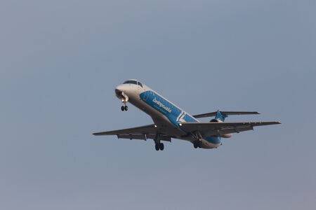 Borispol, Ukraine - March 15, 2014  Dniproavia Airlines Embraer ERJ-145LR aircraft on final approach to Borispol International Airport on March 15, 2014  Editorial use onlyのeditorial素材