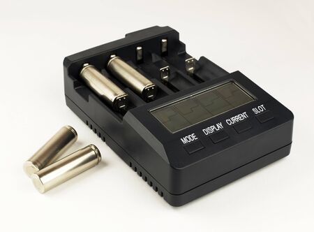 Intelligent accumulator battery charger on the white backgroundの写真素材