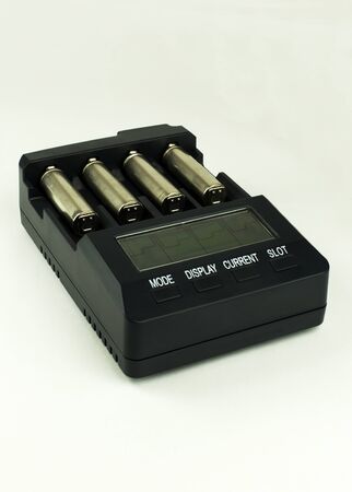 Intelligent accumulator battery charger on the light backgroundの写真素材