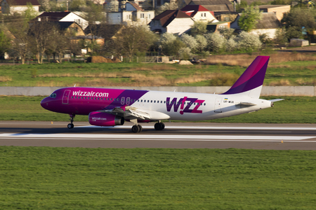 Kiev, Ukraine - April 25, 2014: UR-WUB Wizz Air Airbus A320 aircraft landing on the runway of Kiev International Airport. Editorial use onlyのeditorial素材