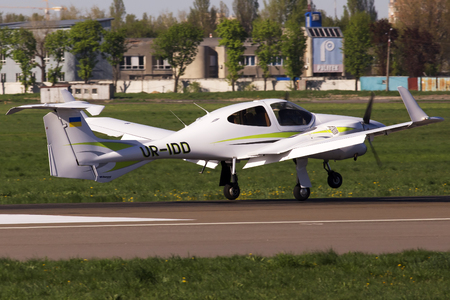 Kiev, Ukraine - April 25, 2014: Diamond DA42 Twin Star business aircraft landing on the runway of Kiev International Airport. Editorial use onlyのeditorial素材