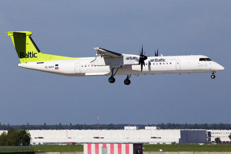 Borispol, Ukraine - May 26, 2018: YL-BAF Air Baltic De Havilland Canada DHC-8-400 aircraft landing on the runway of Borispol International Airport. Editorial use onlyのeditorial素材