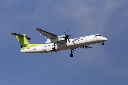 Borispol, Ukraine - May 25, 2018: YL-BAH Air Baltic De Havilland Canada DHC-8-400 aircraft on the cloudy sky background. Editorial use onlyのeditorial素材