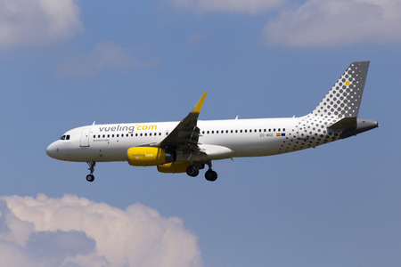 Borispol, Ukraine - May 25, 2018: EC-MGE Vueling Airbus A320-200 aircraft on the cloudy sky background. Editorial use onlyのeditorial素材