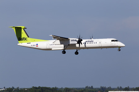 Borispol, Ukraine - May 26, 2018: YL-BAF Air Baltic De Havilland Canada DHC-8-400 aircraft landing on the runway of Borispol International Airport. Editorial use onlyのeditorial素材