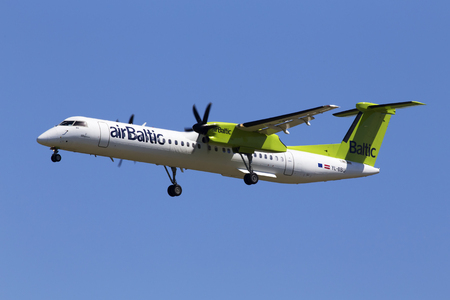 Borispol, Ukraine - May 26, 2018: YL-BBU Air Baltic De Havilland Canada DHC-8-400 aircraft on the blue sky background. Editorial use onlyのeditorial素材