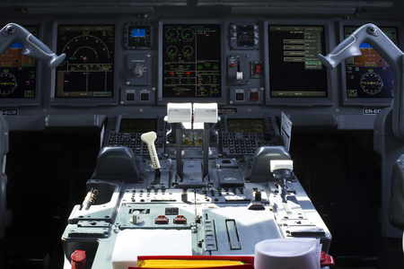 Borispol, Ukraine - August 01, 2018: Inside view of a Embraer ERJ-190 aircraft cockpit. Central panel and frontdeskのeditorial素材