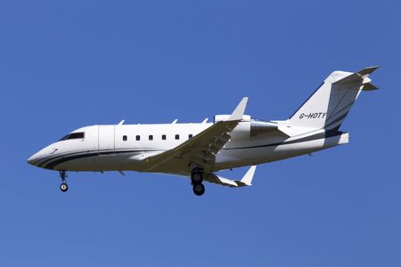 Borispol, Ukraine - May 25, 2018: G-HOTY Bombardier CL-600-2B16 Challenger 604 business jet aircraft on the blue sky backgroundのeditorial素材