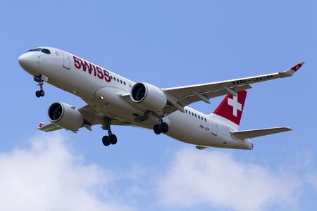 Borispol, Ukraine - June 07, 2019: HB-JCP Swiss Airbus A220-300 aircraft on the cloudy sky backgroundのeditorial素材