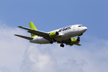 Borispol, Ukraine - June 07, 2019: YL-BBE Air Baltic Boeing 737-53S aircraft on the cloudy sky backgroundのeditorial素材