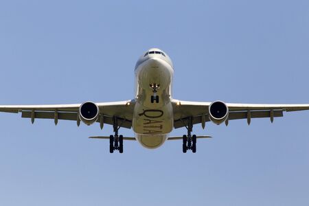 Borispol, Ukraine - May 18, 2019: A7-AEG Qatar Airways Airbus A330-300 aircraft on the blue sky backgroundのeditorial素材