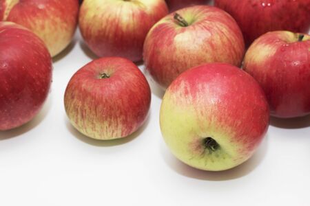Ripe red apples on white background. Copy space for text