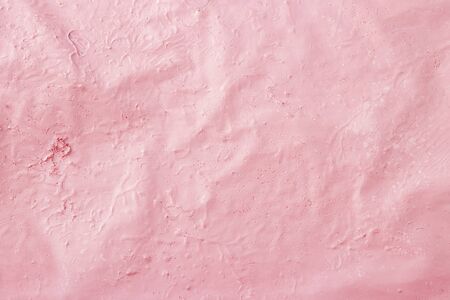 Abstract pink coral gradient background. Pink paint is applied to the surface.の写真素材