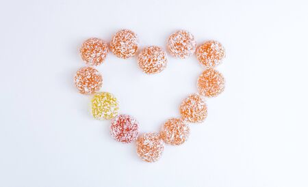 Heart shaped marmalade on a white background. Food for diabetes. Candy without sugar. Copy spaceの写真素材