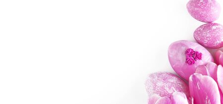 Easter eggs collection. Chicken eggs are painted pink, isolated on a white background. Creative card with Easter. Banner. Copy spaceの写真素材