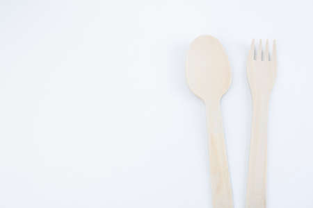 eco friendly disposable kitchen utensils on a white background. wooden fork, spoon. Ecology, zero waste concept. View from above. Flat lay.の写真素材
