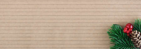 Christmas background. A sheet of ruled notebook or notebook with a Christmas branch. Christmas and New Year concept. Banner. Copy spaceの写真素材