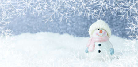 Christmas background. Happy snowman standing in a winter Christmas landscape. Merry christmas and...