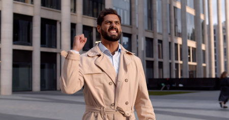 Happy entrepreneur celebrating business success outdoorsの写真素材
