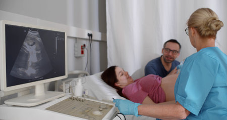 Expecting happy couple visiting doctor for ultrasound test.の写真素材
