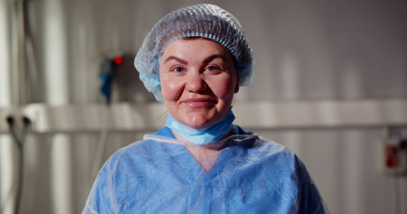 Portrait of happy woman surgeon smiling at cameraの写真素材