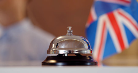 Cropped shot of hotel reception service bell to attract attention