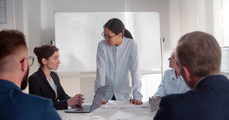 Business colleagues in conference meeting room working on new projectの写真素材