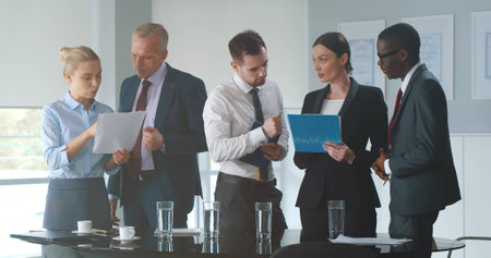 Confident businesspeople discussing analytics data
