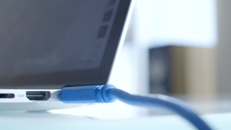 Close up of connected blue USB Port to Laptopの写真素材