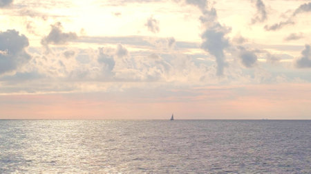Beautiful sky with dramatic clouds over the sea. Dramatic sunset or sunrise over the sea.