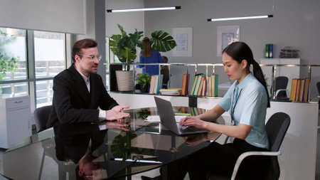 Successful entrepreneur present startup idea to bank managerの写真素材