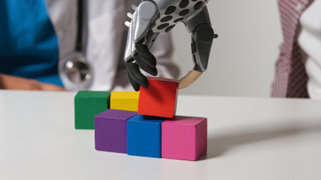 Close up of patient with arm prosthesis movie wooden blocks making pyramidの写真素材