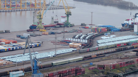 Logistics and transportation of Container Cargo ship with working crane bridge in shipyard