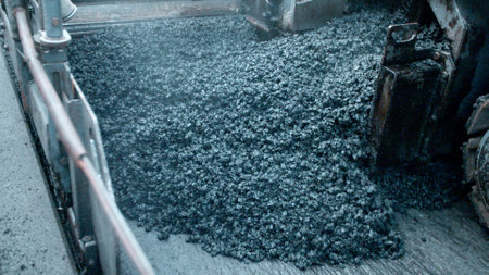 Close up of asphalt paver machine during road construction