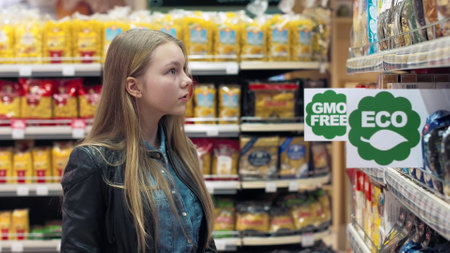 People in the supermarket Eco-friendly products go between the rows and chooseの写真素材