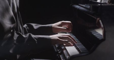Piano music pianist hands playing. Musical instrument grand piano details 4Kの写真素材