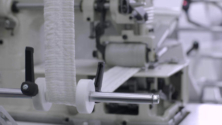 Machine producing in textile factoryの写真素材