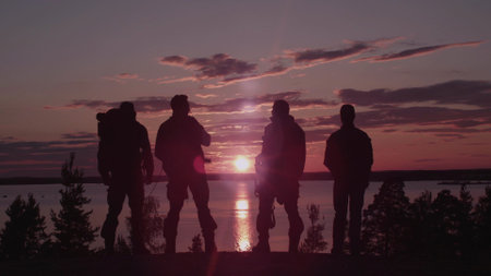Men at Sunset. Shot with Red Cameraの写真素材