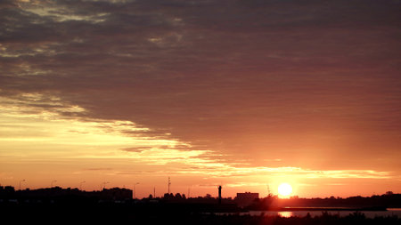 Black silhouette of the river port over sunset sky backgroundの写真素材