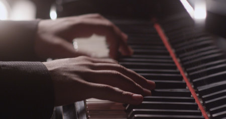 Piano music pianist hands playing. Musical instrument grand piano details 4Kの写真素材