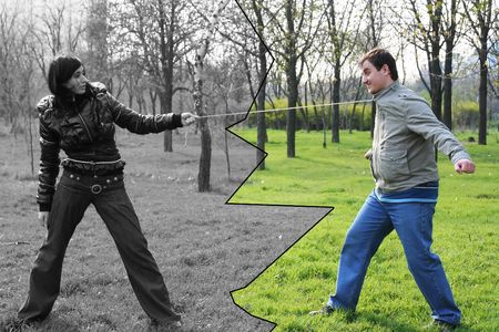 The woman leads the man in a stringの写真素材